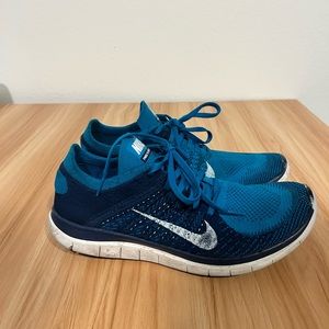 Size 10.5 Blue Nike Flyknit Free